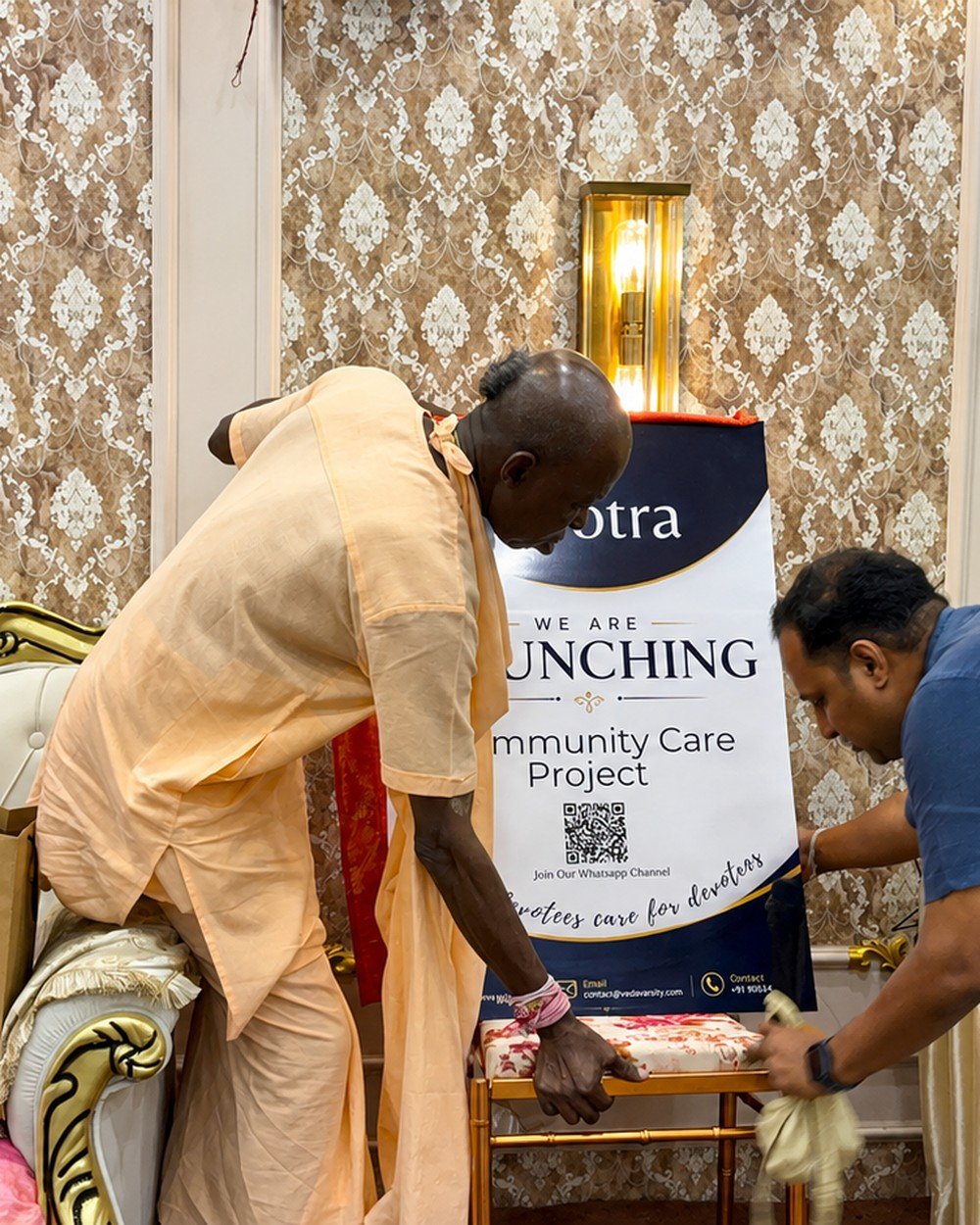 Brajsundar Das launching the Community Care Project with a devotee