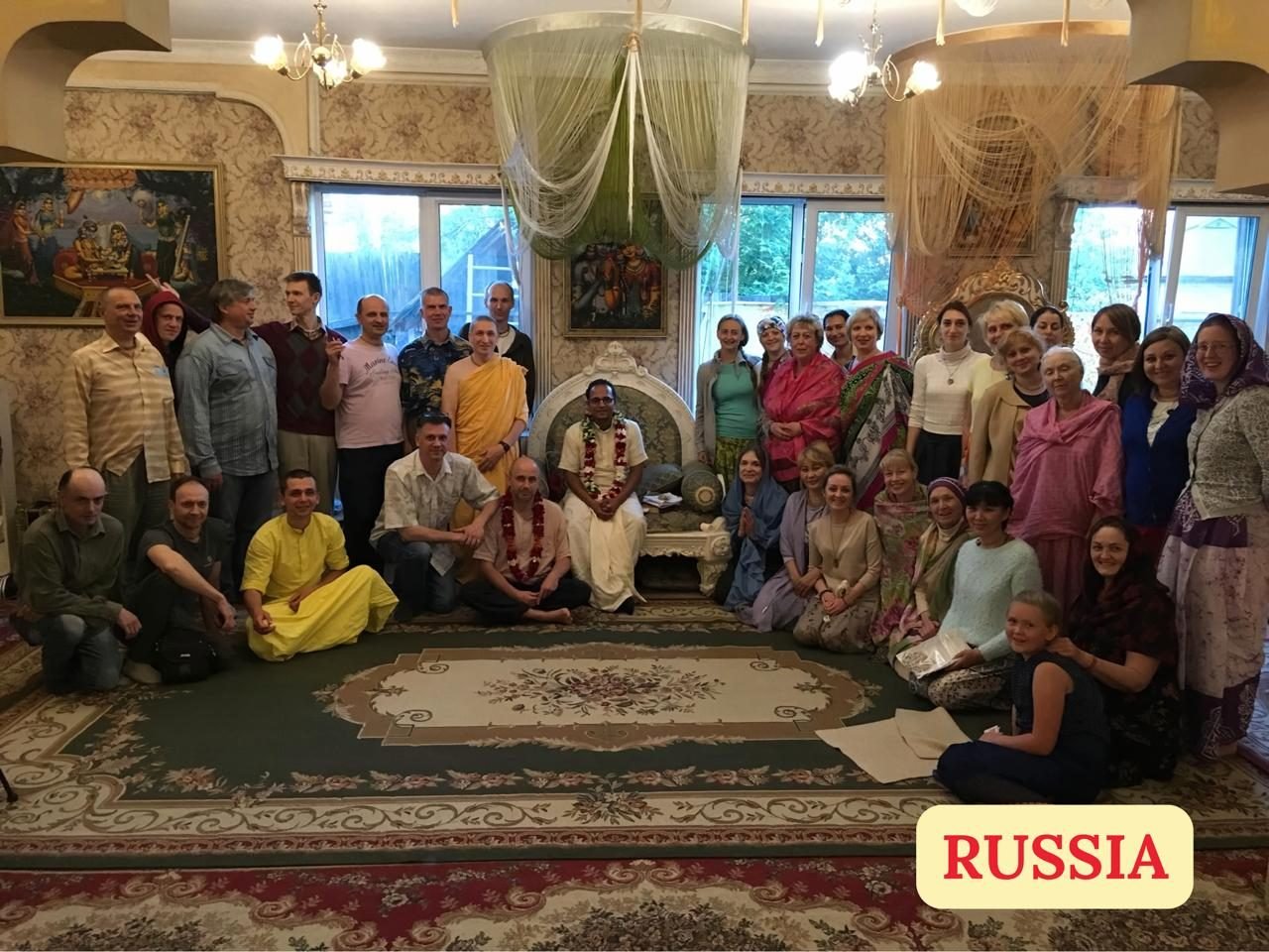 Brajsundar Das with devotees at a home program in Russia